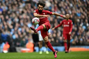 Liverpool star Mohamed Salah shoots against Manchester City