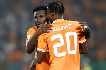 Franck Kessie (L) celebrates scoring for Ivory Coast with Christian Kouame.