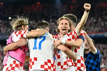 Croatia midfielder Luka Modric (C) celebrates with teammates after winning the Nations League semi against the Netherlands