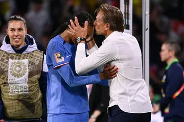 France coach Herve Renard kisses Wendie Renard on the forehead after her goal secured a 2-1 win over Brazil on Saturday