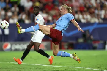 Erling Haaland (R) struck twice on his first Champions League outing for Manchester City