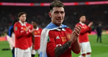 Lisandro Martinez applauds as Manchester United players celebrate their win on the pitch after the English League Cup final football match between Manchester United and Newcastle United at Wembley Stadium. Photo by Glyn Kirk.