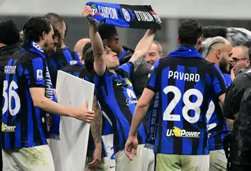 Nicolo Barella (C) celebrates winning the 2024 Serie A title with Inter Milan on April 22
