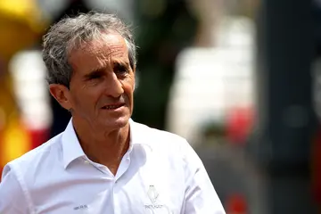When did Alain Prost win his first championship?