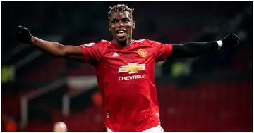 Paul Pogba celebrates assisting his team's second goal during a Premier League match between Manchester United and Brighton at Old Trafford. Photo by Ash Donelon.