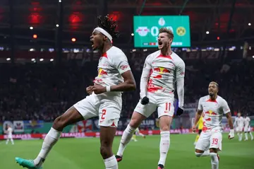 Leipzig forward Timo Werner (C) celebrates scoring with teammate Mohamed Simakan as the German Cup holders booted out Borussia Dortmund on Wednesday