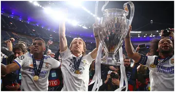 Luka Modric celebrates with Marcelo and the trophy at the end of the UEFA Champions League final match between Liverpool FC and Real Madrid at Stade de France. Photo by Chris Brunskill.