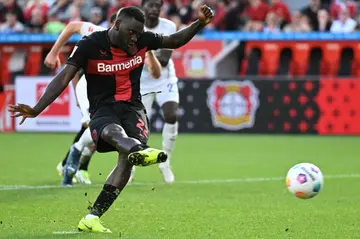 Bayer Leverkusen's Nigerian forward Victor Boniface scores his second from the spot