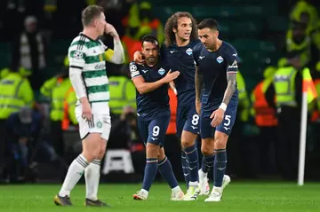 Pedro Rodriguez celebrates with his Lazio teammates after netting a late winner against Celtic in Glasgow