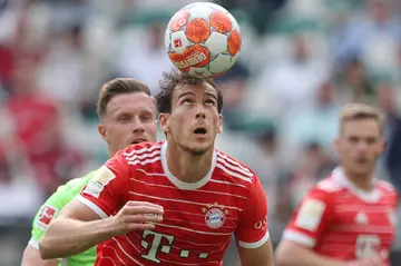 Bayern Munich midfielder Leon Goretzka (C) will miss the start of the Bundesliga season following knee surgery