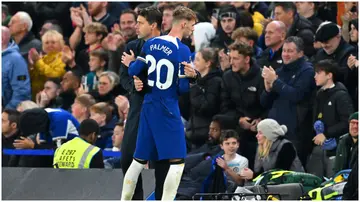 Mauricio Pochettino embraces Cole Palmer during the Premier League match between Chelsea FC and Arsenal FC at Stamford Bridge. Photo by Michael Regan.