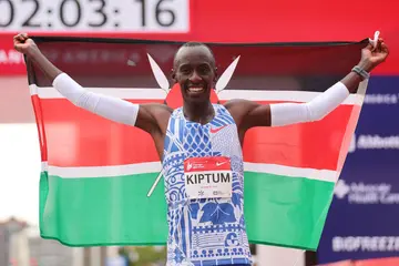 Kelvin Kiptum celebrates after winning and setting a new record at the Chicago Marathon on October 8.