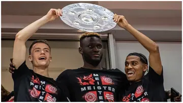 Victor Boniface, Florian Wirtz and Amine Adli of Bayer 04 Leverkusen celebrate their first Bundesliga title in the stadium. Photo: Hesham Elsherif.