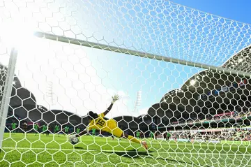 Nigeria's goalkeeper Chiamaka Nnadozie saves a penalty from Canada's Christine Sinclair