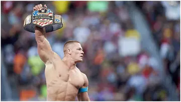 John Cena in the ring with a belt during an event at Levi's Stadium. Photo by Jed Jacobsohn.