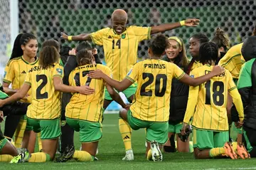 Jamaica's players celebrate qualifying for the next round of the Women's World Cup after knocking Brazil out with a 0-0 draw in Melbourne
