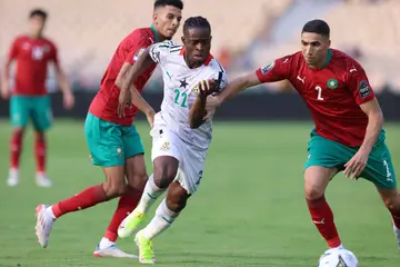 Ghana's Kamaldeen Sulemana (in white) vies with Morocco's Achraf Hakimi (in red) during the AFCON 2021 match at Ahmadou Ahidjo stadium in Yaounde on January 10, 2022