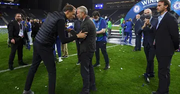 Roman Abramovich, owner of Chelsea talks to Thomas Tuchel, Manager of Chelsea following his team's victory during the UEFA Champions League (Photo by Alex Caparros - UEFA/UEFA via Getty Images)