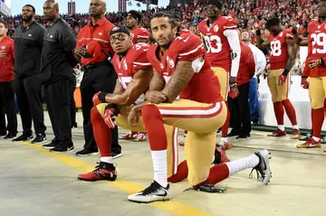 Making a stand: Eric Reid (l) and  Colin Kaepernick (r) kneel in protest