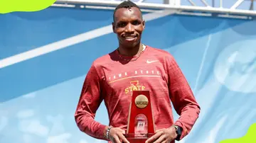 Wesley Kiptoo with an award