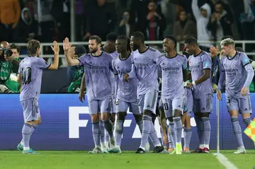 Real Madrid's players celebrate their third goal during the FIFA Club World Cup semi-final win over Al-Ahly