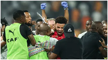 South African players celebrate after winning at the end of the Africa Cup of Nations 2023 quarter-final football match against Cape Verde. Photo: FRANCK FIFE.