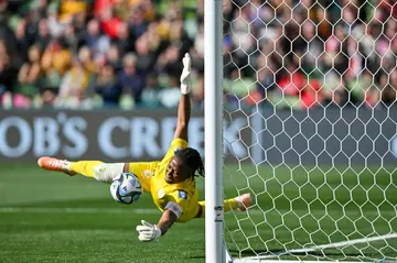 Nigeria's goalkeeper Chiamaka Nnadozie saves a penalty kick by Canada's Christine Sinclair