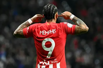 Atletico Madrid's Dutch forward Memphis Depay celebrates scoring his team's winning goal against Sevilla in the Copa del Rey