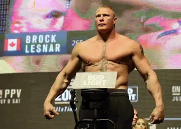 Mixed martial artist Brock Lesnar poses on the scale during his weigh-in for UFC 200 at T-Mobile Arena on July 8, 2016 in Las Vegas, Nevada. (Photo by Ethan Miller/Getty Images)