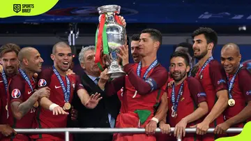 Portugal players lift the 2016 UEFA EURO trophy