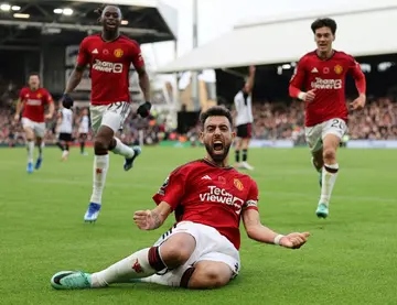 Captain fantastic: Bruno Fernandes (centre) scored Manchester United's late winner at Fulham