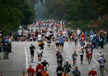 Marathon participants run on Summit Avenue in St. Paul