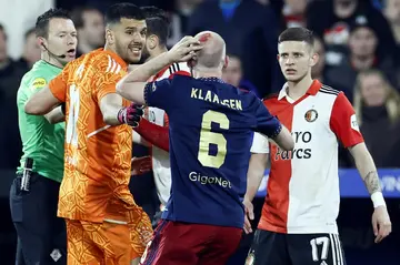 The Dutch cup semi-final was interrupted for almost half an hour when a lighter thrown from the stands hit Ajax player Davy Klaassen in the head