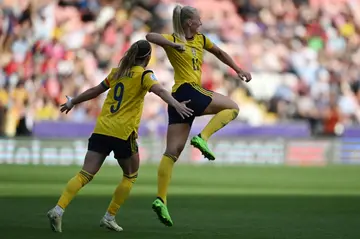 Stina Blackstenius (right) celebrates scoring Sweden's fifth goal