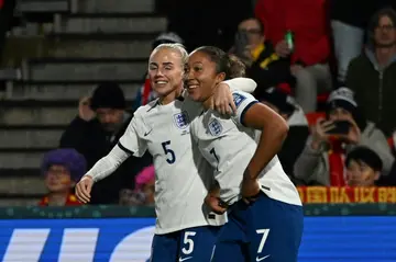 England forward Lauren James (R) celebrates scoring her team's fourth  against China