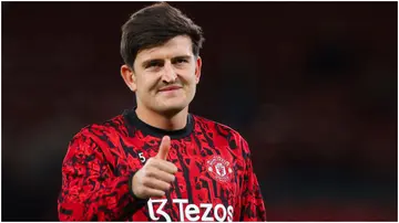 Harry Maguire interacts with supporters prior to the Carabao Cup Third Round match between Manchester United and Crystal Palace at Old Trafford. Photo by James Gill.