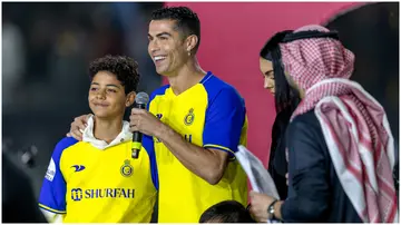 Cristiano Ronaldo and his son during his official unveiling as an Al Nassr player. Photo by Yasser Bakhsh.