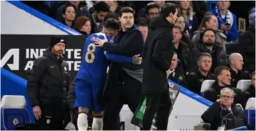 Mauricio Pochettino interacts with Enzo Fernandez after he left the pitch during the Carabao Cup Quarter Final match between Chelsea and Newcastle United. Photo by Mike Hewitt.