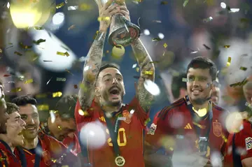 New Real Madrid signing Joselu (C) holds the UEFA Nations League Cup after Spain beat Croatia on Sunday