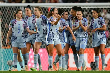 Aitana Bonmati celebrates in front of her teammates after scoring in Spain's rout of Switzerland