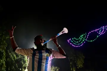 An Argentina fan in Dhaka blows a vuvuzela as he cheers on his favourite team