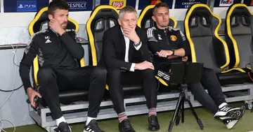 Michael Carrick, Solskjaer and Kieran McKenna watch from the bench ahead of the UEFA Champions League group F match between BSC Young Boys and Manchester United. (Photo by Matthew Peters/Manchester United via Getty Images)