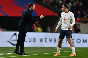 England manager Gareth Southgate gives instructions to Jack Grealish