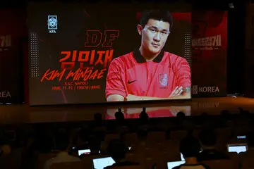South Korea's Kim Min-jae on a screen as their World Cup squad was named