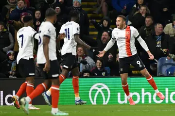 Luton striker Carlton Morris (R) celebrates after scoring at Burnley