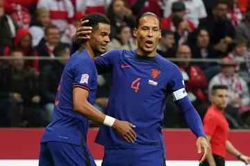 Cody Gakpo (L) scored the opener in the Netherlands' win over Poland