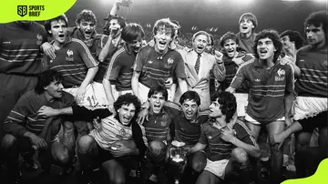 French players pose around the Euro 1984 Cup