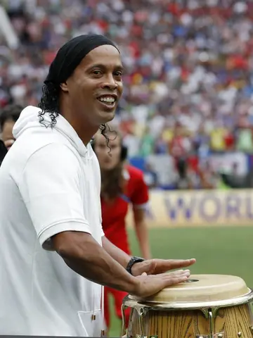 Brasil World Cup winner Ronaldinho in police custody over fake passport claims