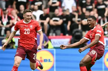 Switzerland's Kwadwo Duah celebrates scoring the opening goal against Hungary in Cologne with teammate Michel Aebischer