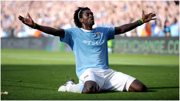 Emmanuel Adebayor celebrates in front of the Arsenal fans after scoring during the Premier League match between City and Arsenal at the City of Manchester Stadium. Photo by Shaun Botterill.